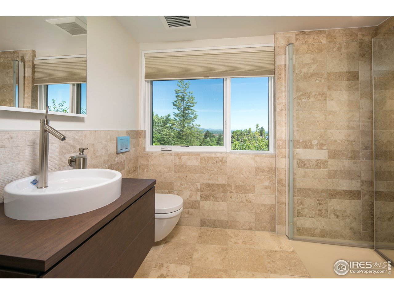 2235 Vassar Drive Boulder, CO 80305 - Photo 35 of 40 a bathroom with a sink a toilet and shower