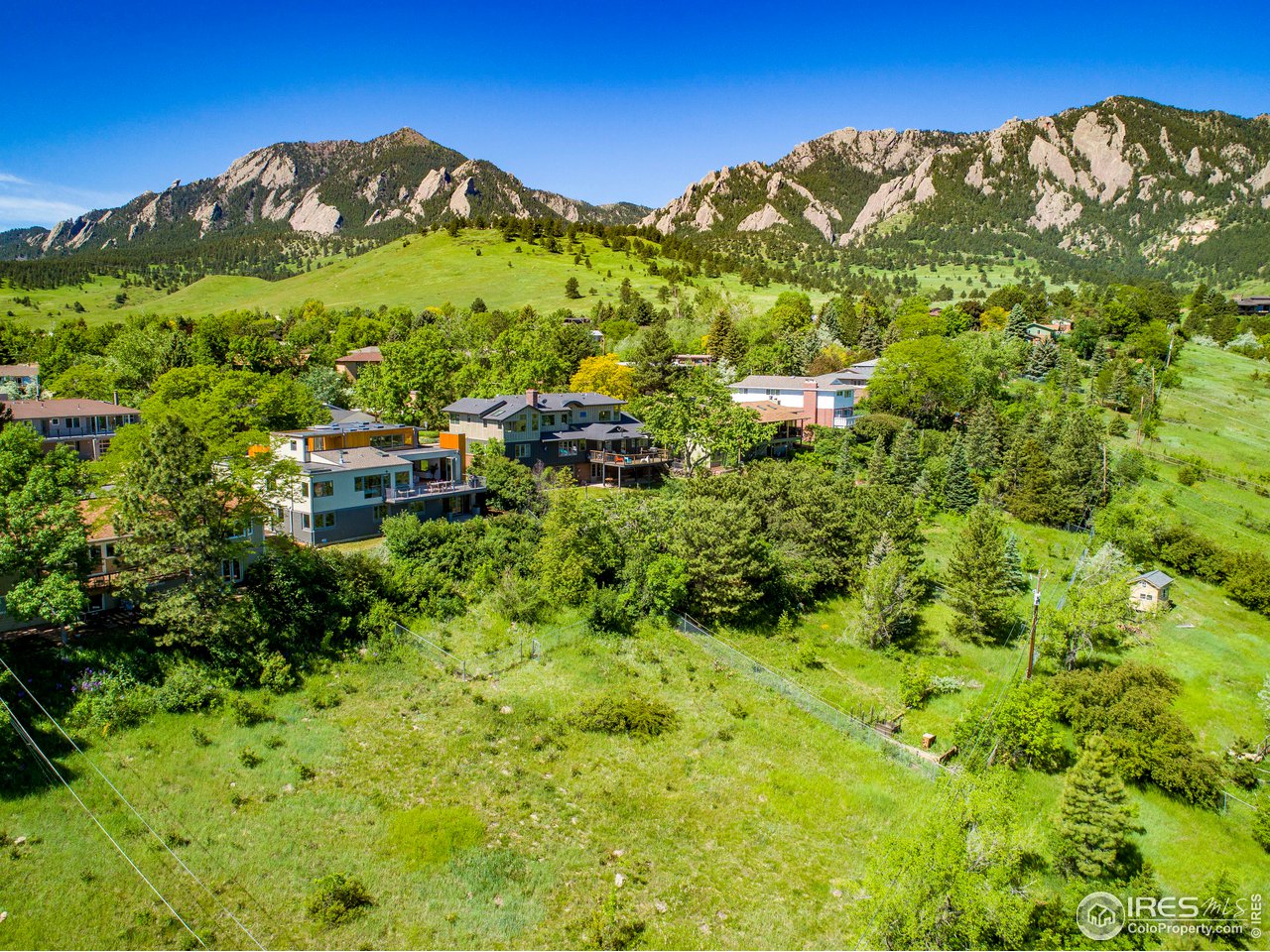 2235 Vassar Drive Boulder, CO 80305 - Photo 39 of 40 a view of a lush green field with mountains in the background