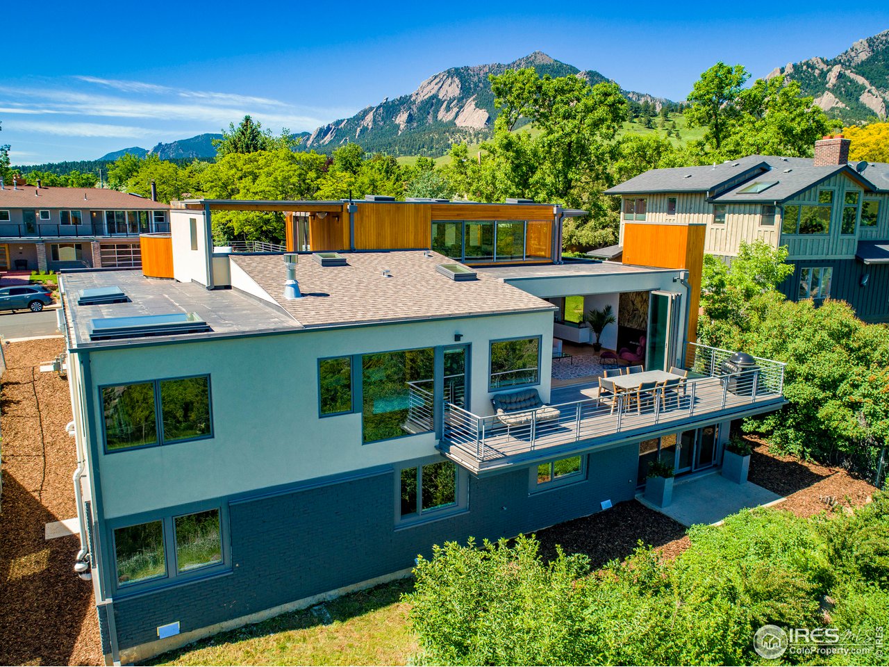 2235 Vassar Drive Boulder, CO 80305 - Photo 40 of 40 a view of a house with a backyard and sitting area