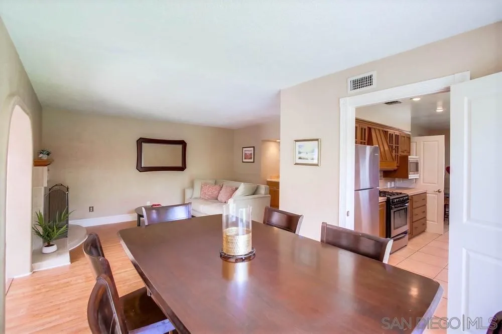 14655 Evening Star Drive Poway, CA 92064 - Photo 15 of 33 a living room with couches chairs and kitchen view with wooden floor