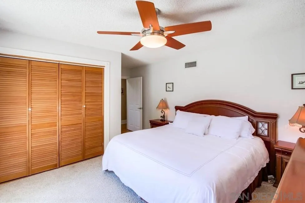 14655 Evening Star Drive Poway, CA 92064 - Photo 22 of 33 a bedroom with a bed and a ceiling fan