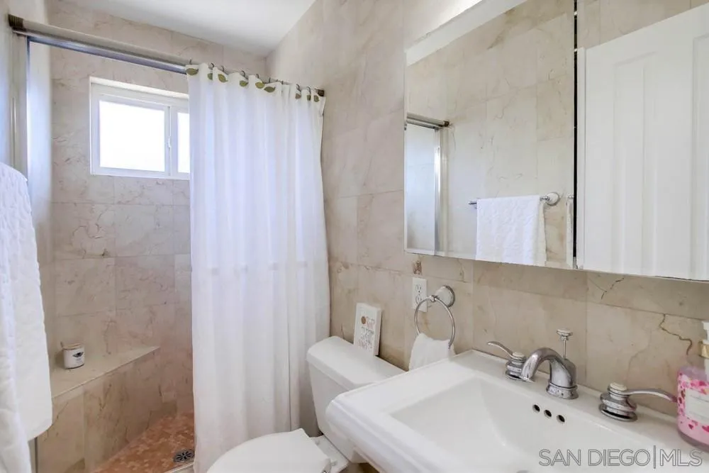 14655 Evening Star Drive Poway, CA 92064 - Photo 23 of 33 a bathroom with a sink a toilet and shower