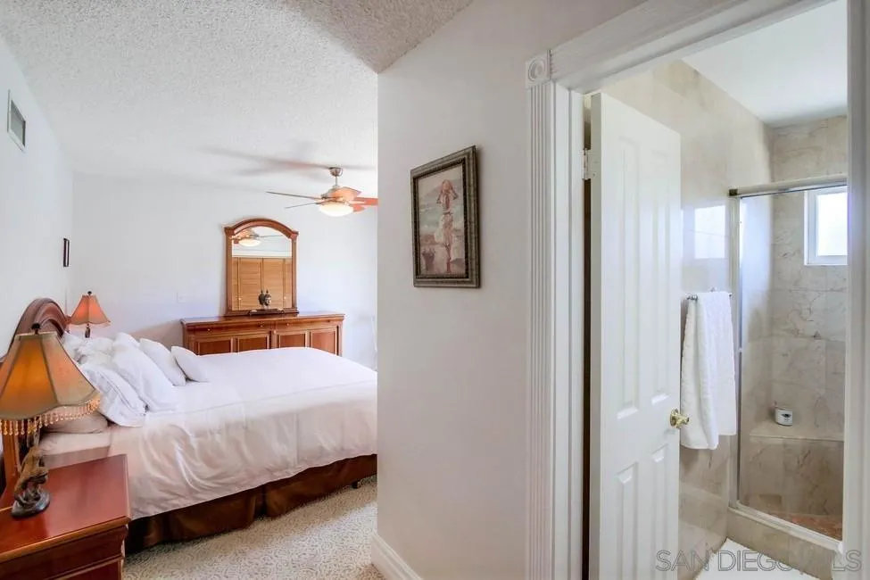 14655 Evening Star Drive Poway, CA 92064 - Photo 24 of 33 a bedroom with a bed and a mirror