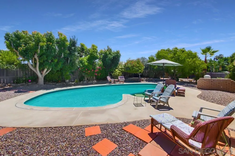 14655 Evening Star Drive Poway, CA 92064 - Photo 33 of 33 a view of a swimming pool and lounge chairs