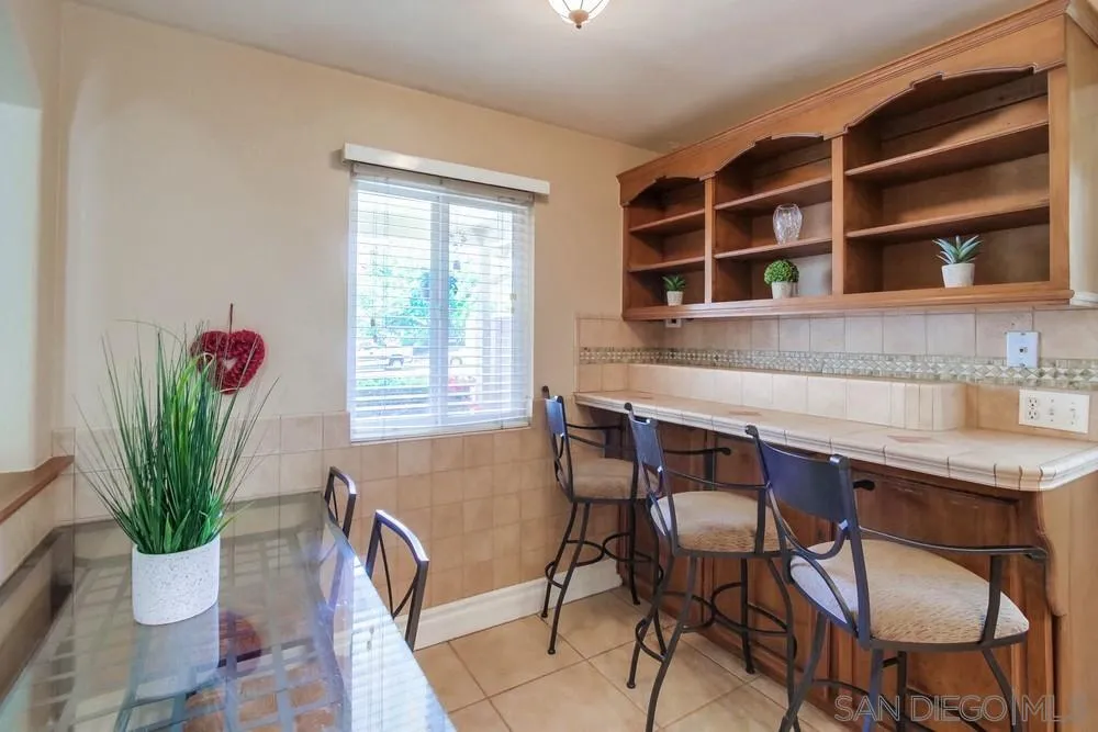 14655 Evening Star Drive Poway, CA 92064 - Photo 6 of 33 a view of a dining room with furniture and a potted plant