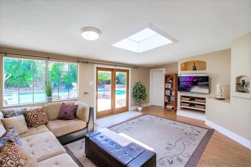 14655 Evening Star Drive Poway, CA 92064 - Photo 10 of 33 a living room with furniture and a flat screen tv