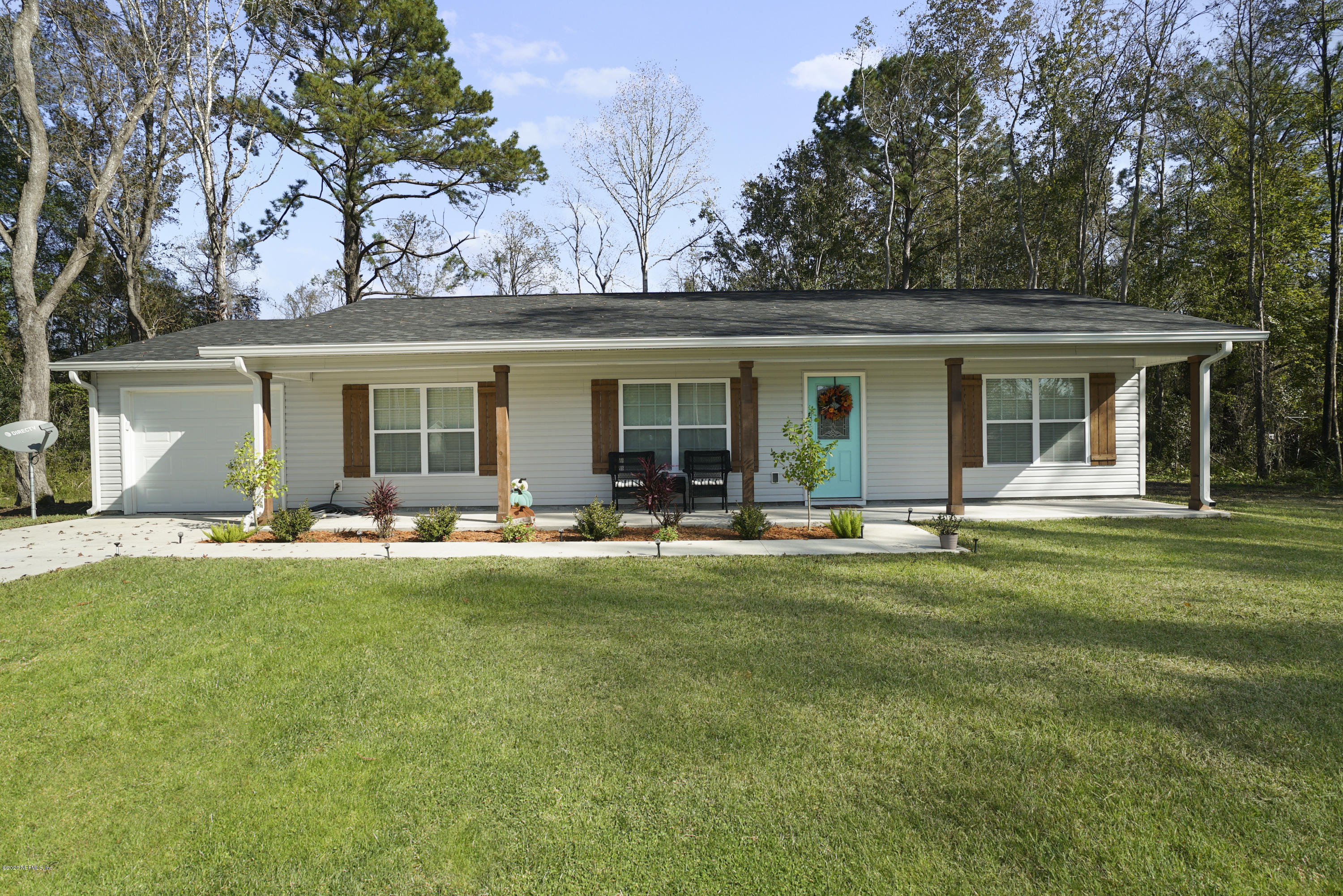 54096 Jeannie Road Callahan, FL 32011 - Photo 1 of 19 a view of a house with backyard and sitting area