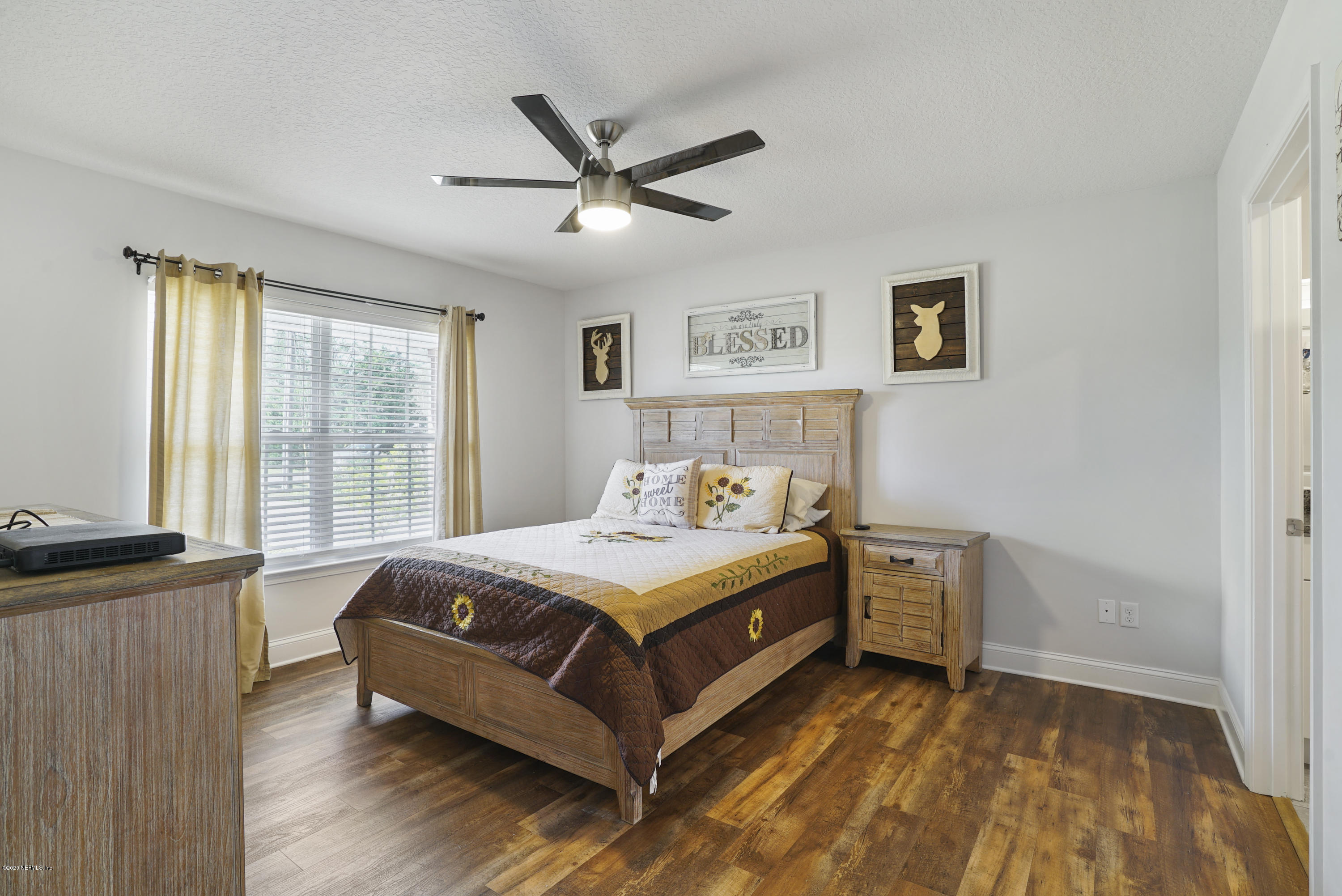 54096 Jeannie Road Callahan, FL 32011 - Photo 11 of 19 a bed room with a bed and a window