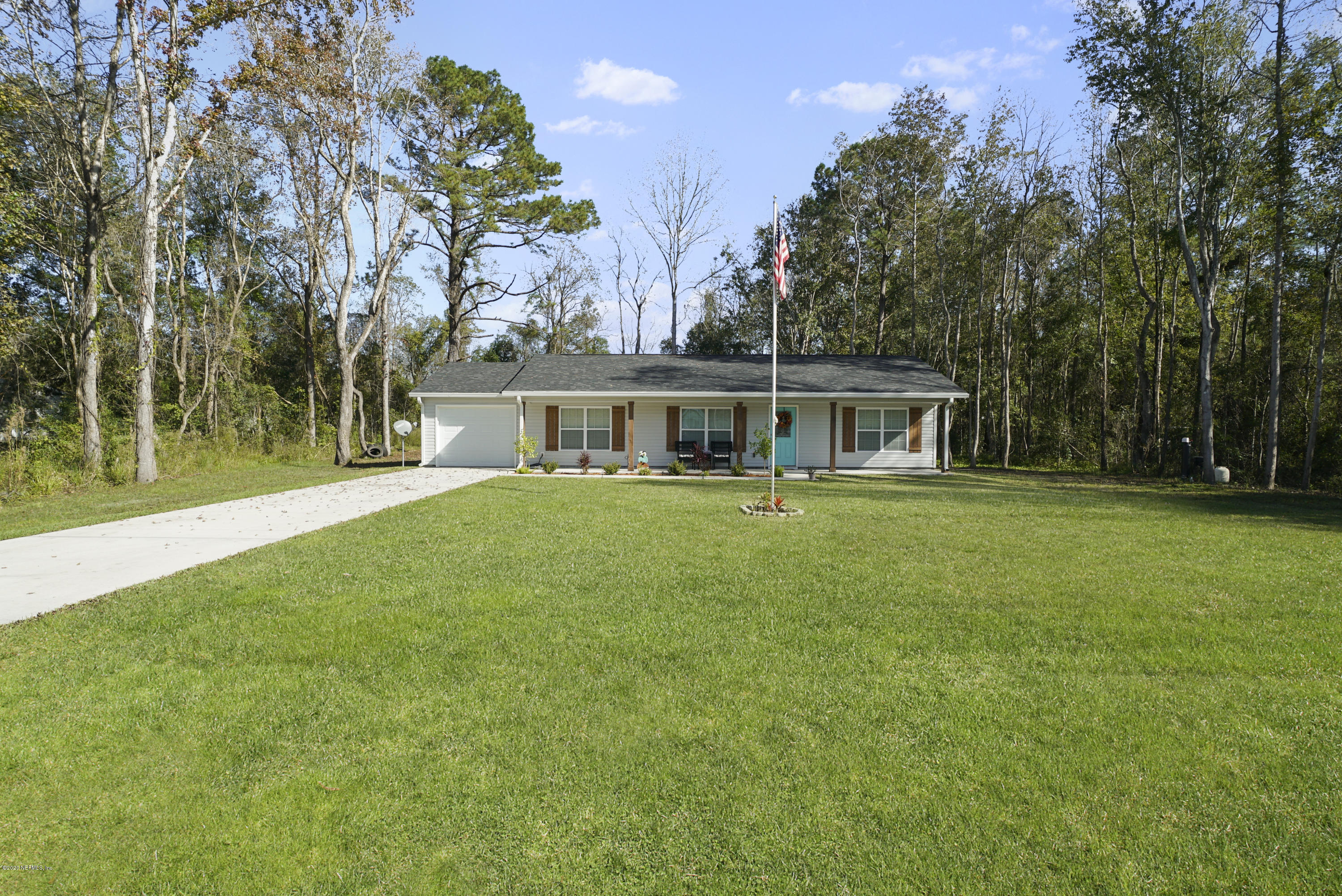 54096 Jeannie Road Callahan, FL 32011 - Photo 2 of 19 a view of a house with a backyard