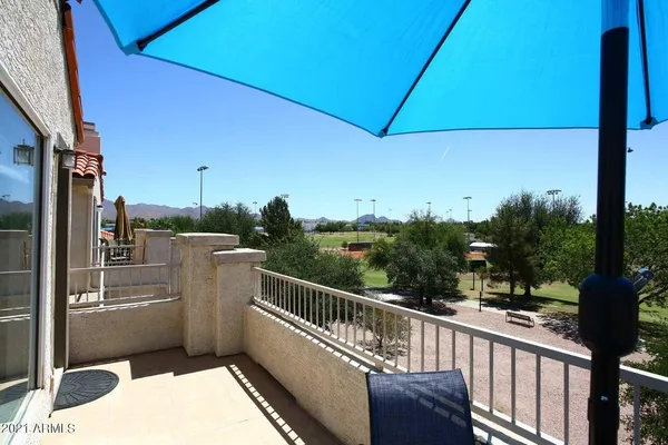 a balcony with an outdoor space