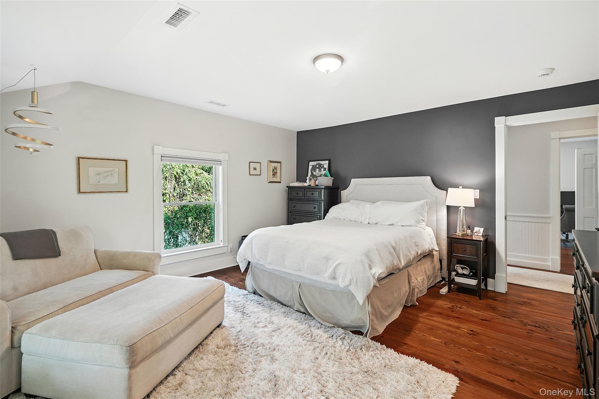 548 Anderson Hill Road Purchase, NY 10577 - Photo 22 of 46 a bedroom with a bed and a large window
