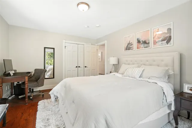 a bed room with a bed and a desk