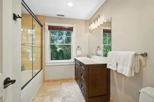 a kitchen with a sink and a refrigerator