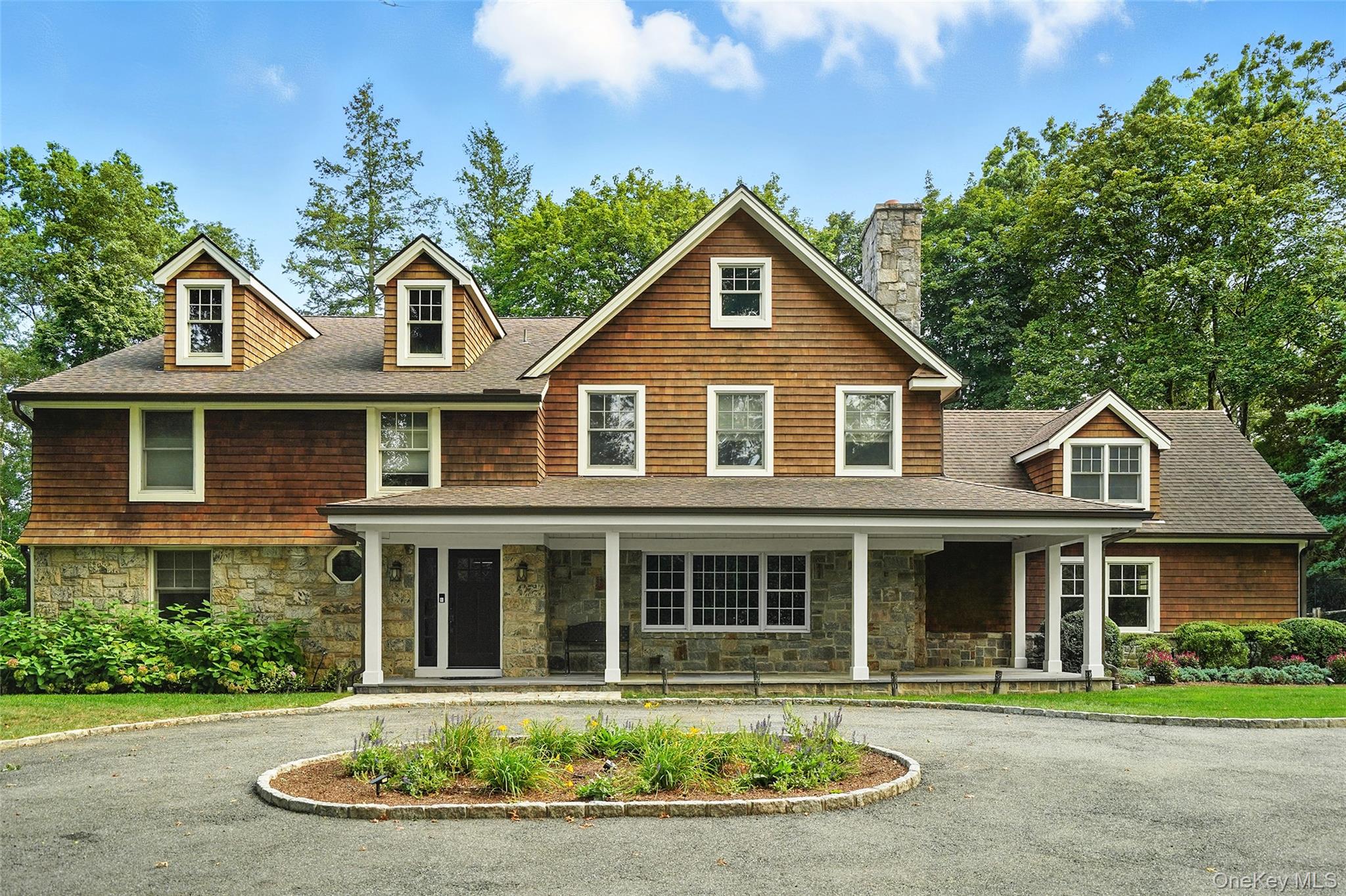 548 Anderson Hill Road Purchase, NY 10577 - Photo 3 of 46 a front view of a house with a yard and potted plants