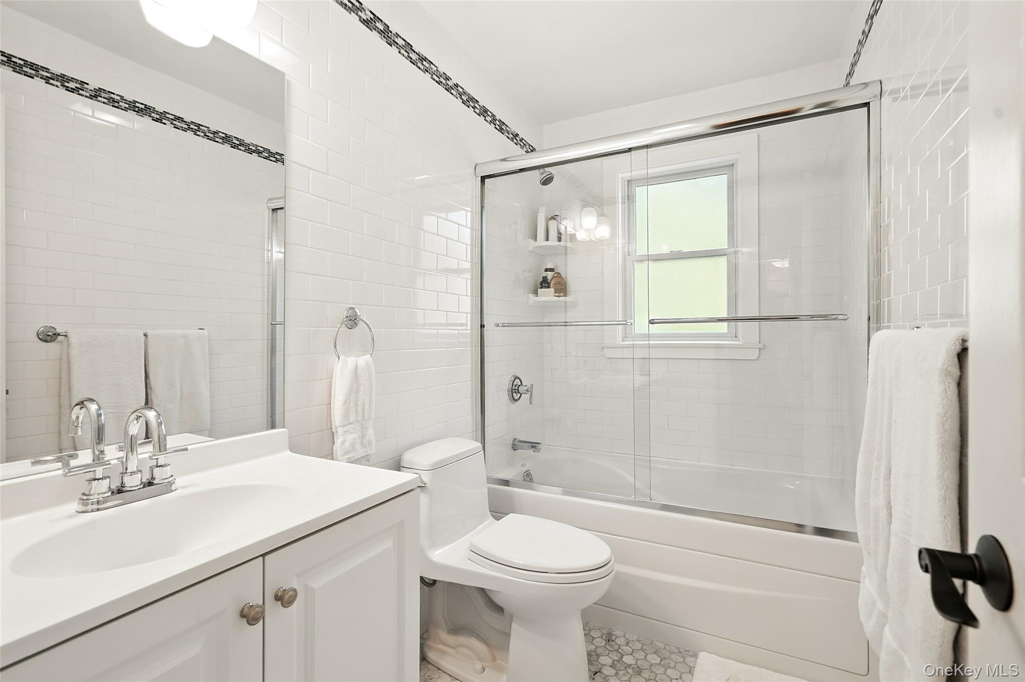 548 Anderson Hill Road Purchase, NY 10577 - Photo 32 of 46 a bathroom with a sink a toilet and shower