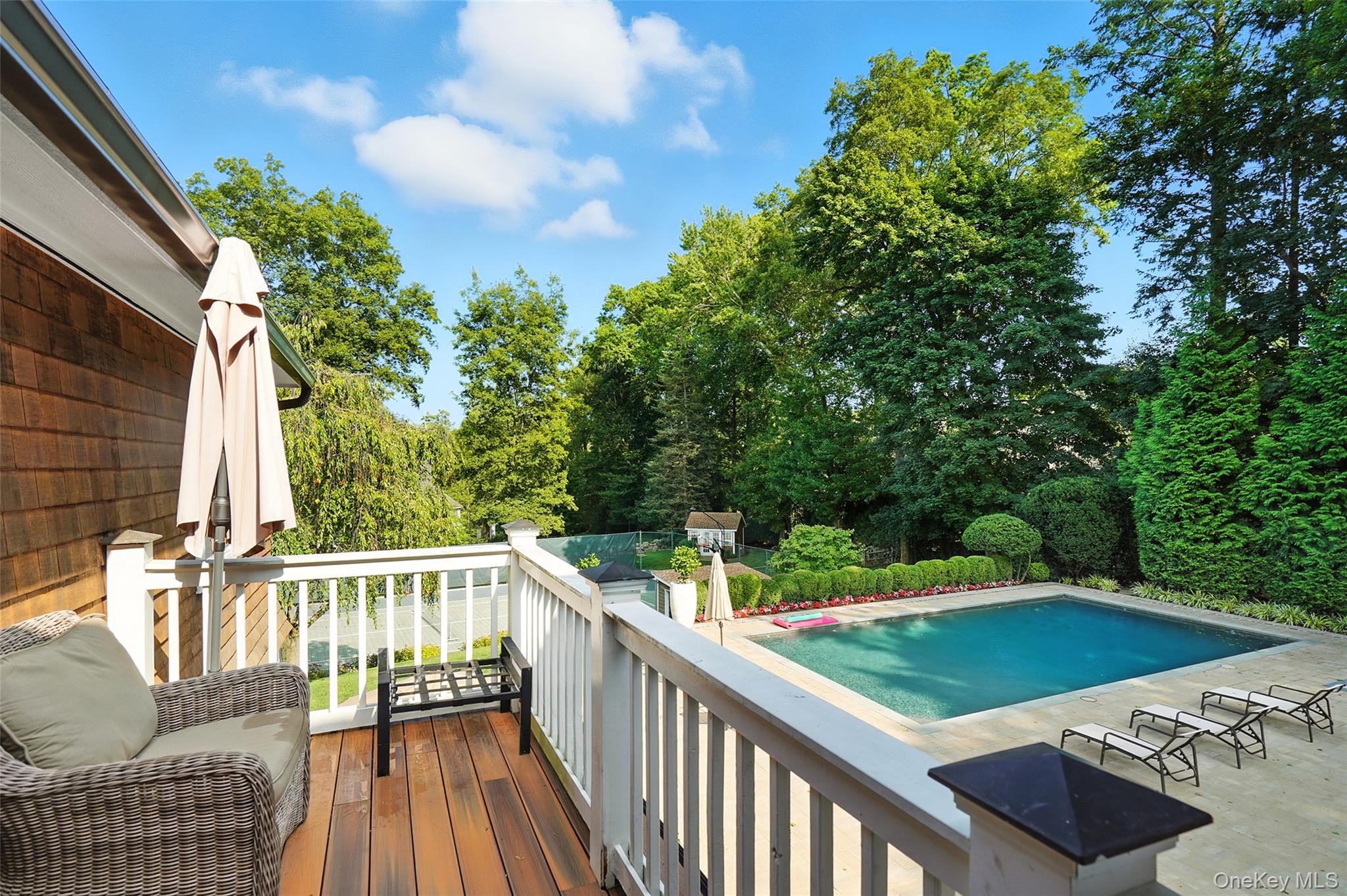 548 Anderson Hill Road Purchase, NY 10577 - Photo 35 of 46 a view of a balcony with chairs