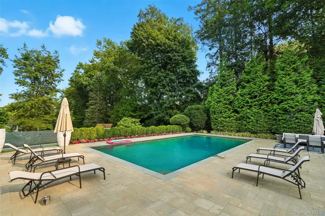 swimming pool with outdoor seating