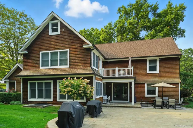 a backyard of a house with yard and barbeque oven