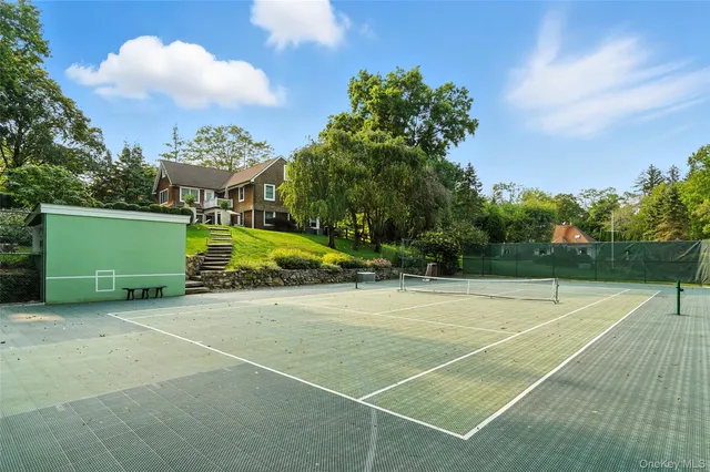 a view of an outdoor space and tennis court