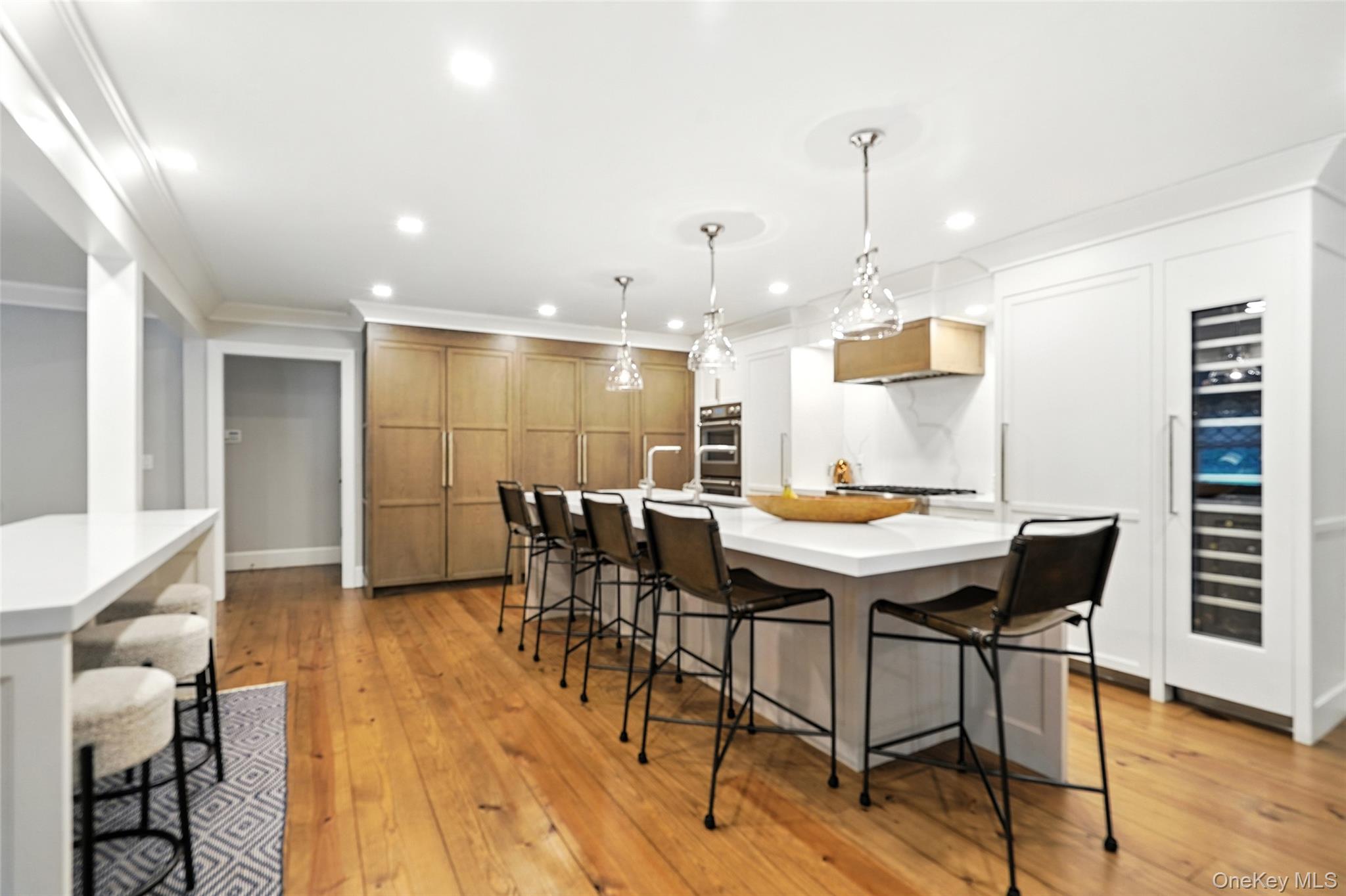 548 Anderson Hill Road Purchase, NY 10577 - Photo 9 of 46 a view of a dining room with furniture and wooden floor
