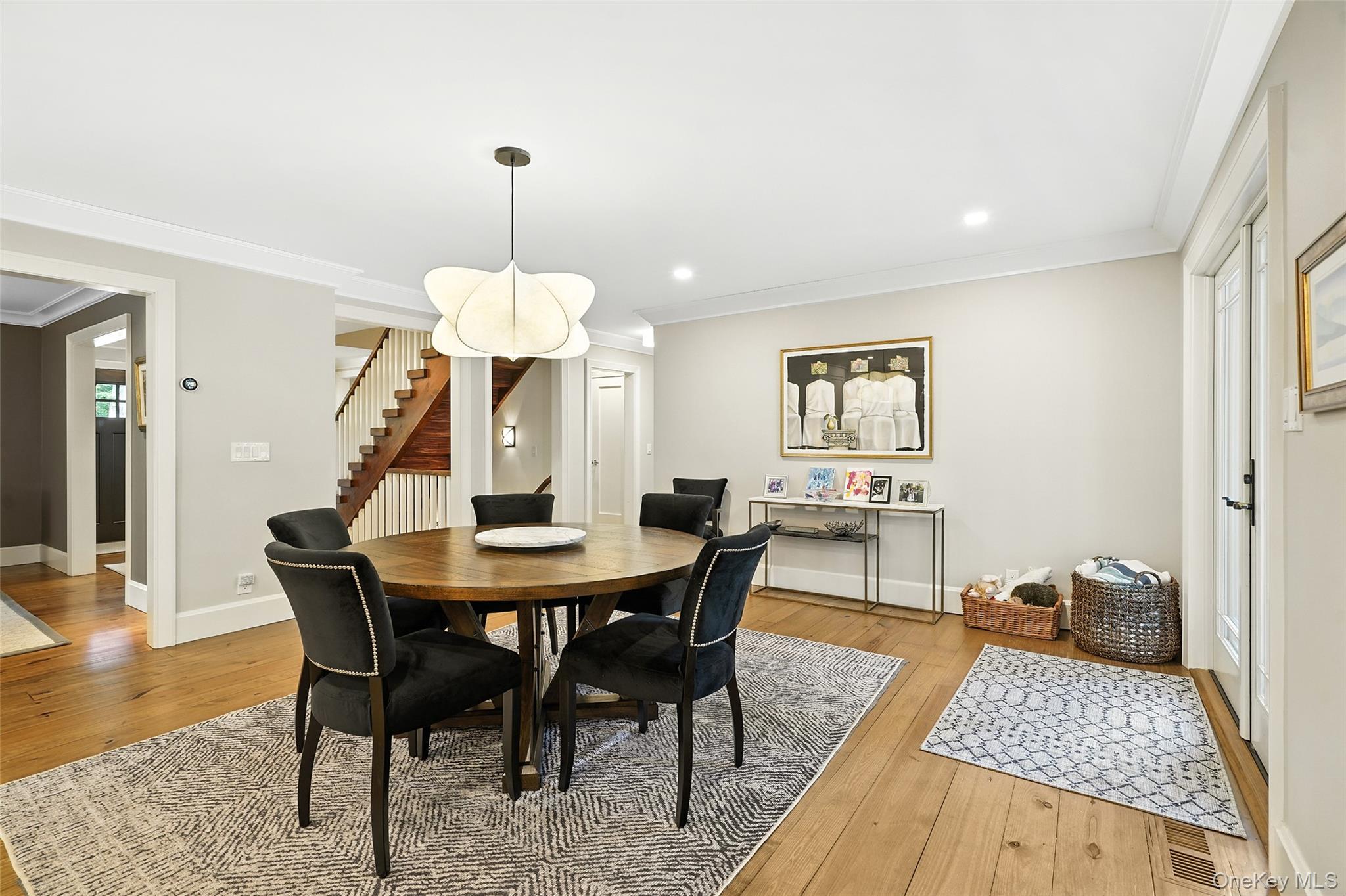 548 Anderson Hill Road Purchase, NY 10577 - Photo 10 of 46 a dining room with furniture a chandelier and wooden floor