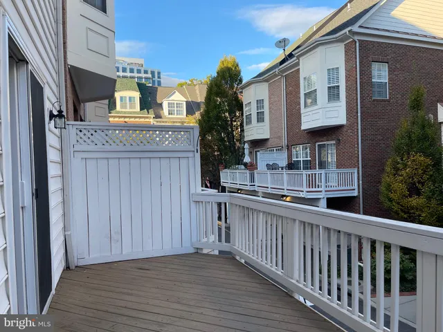 a view of staircase with white walls and railing
