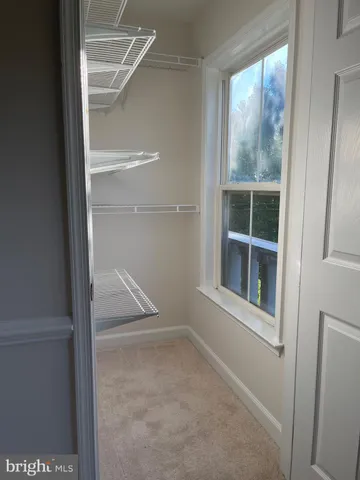 a view of empty room with windows