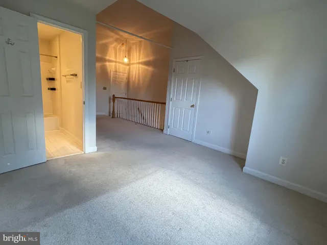 a view of a lake with boats and trees in the background