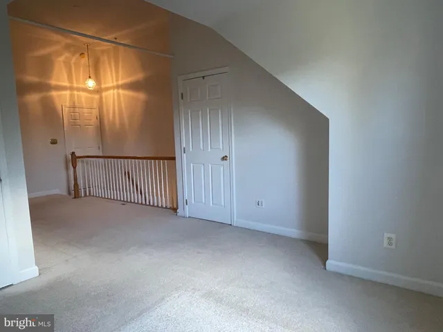 a view of a lake with boats next to a bridge