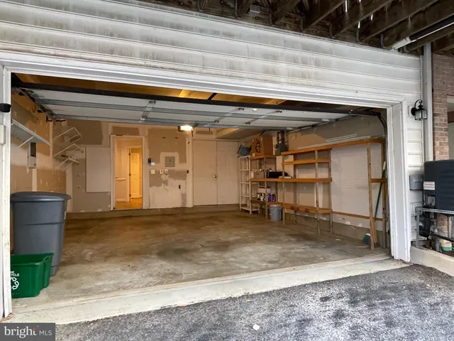 a kitchen with stainless steel appliances granite countertop a refrigerator a sink a stove and cabinets