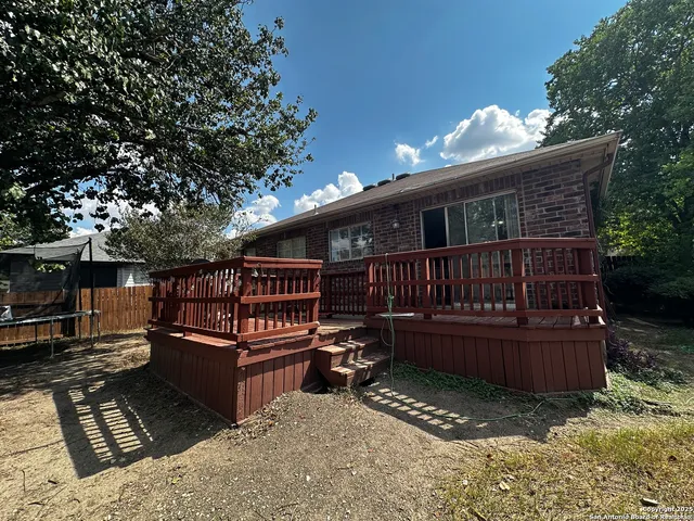a view of backyard with deck