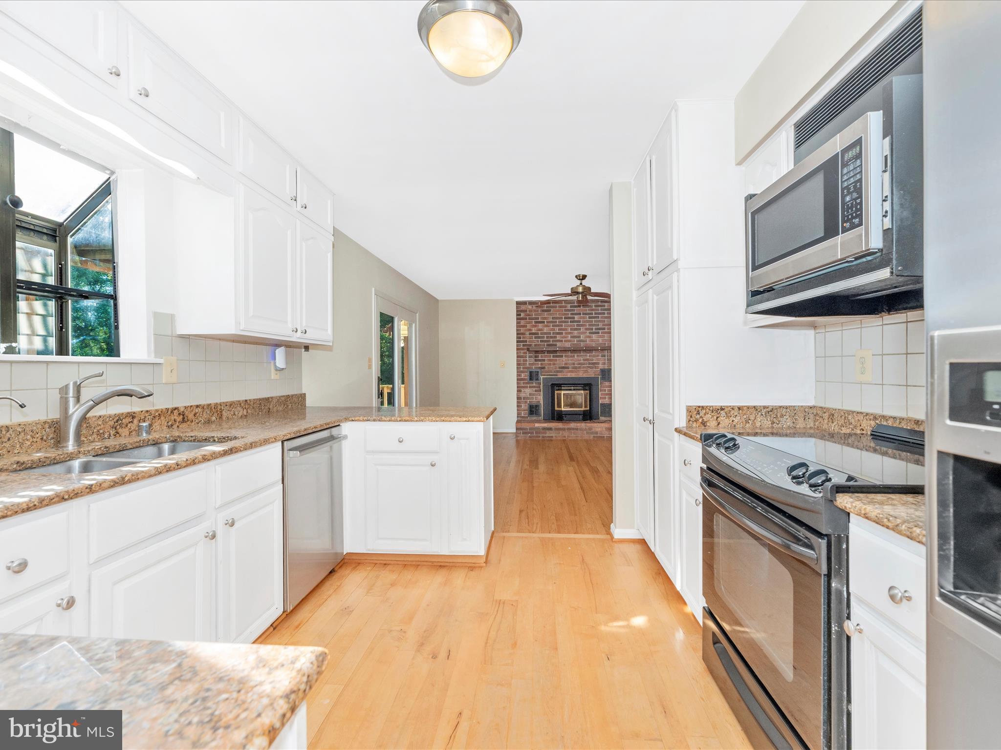 5169 Perry Road Mount Airy, MD 21771 - Photo 14 of 60 a kitchen with a sink stove and refrigerator