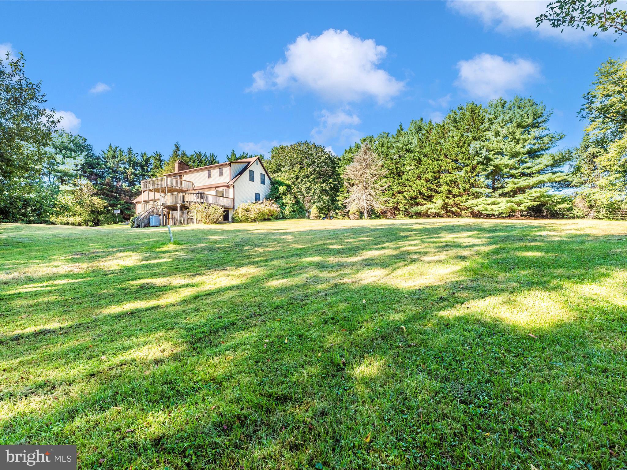 5169 Perry Road Mount Airy, MD 21771 - Photo 50 of 60 a view of a grassy field with an trees