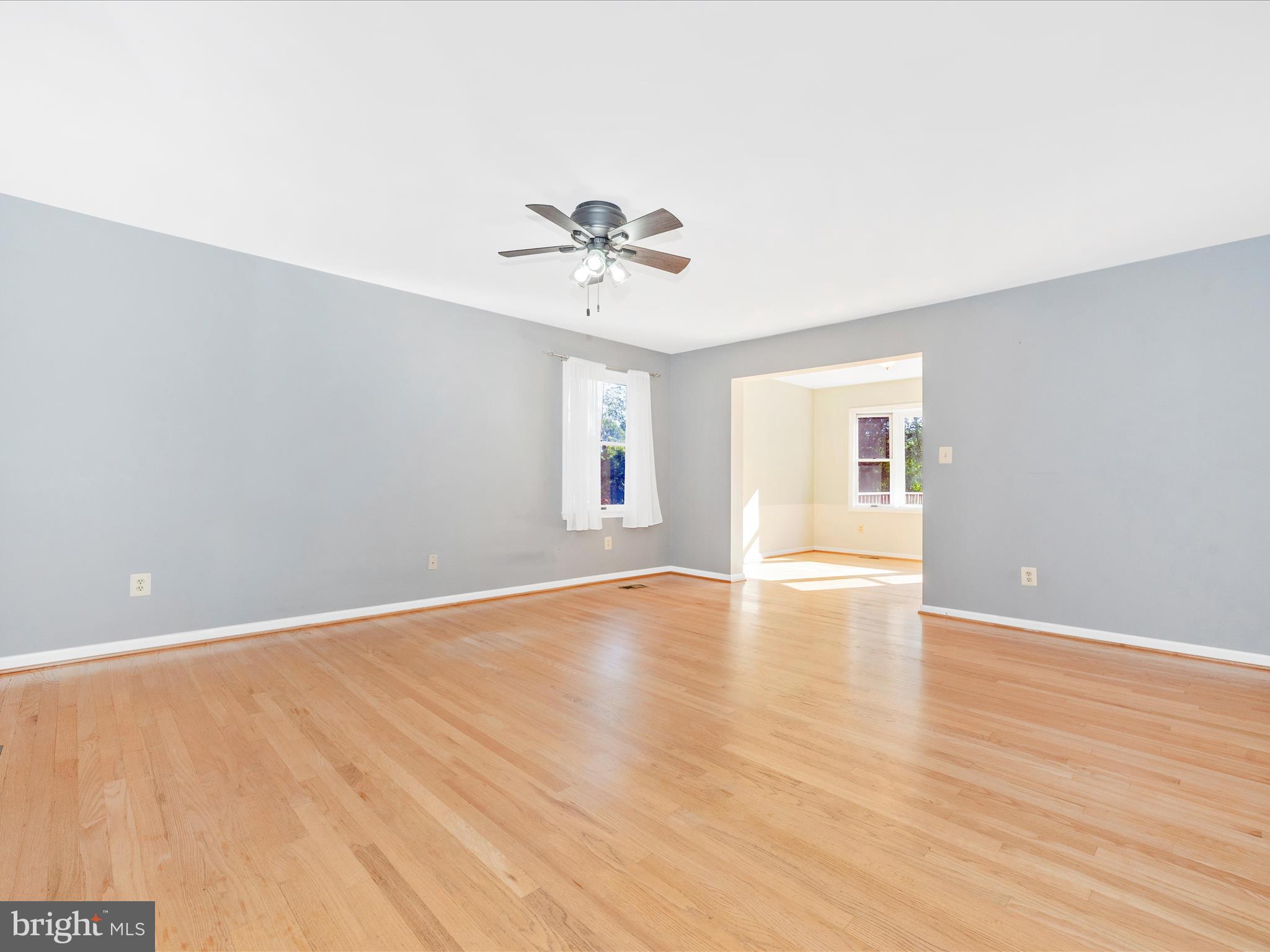 5169 Perry Road Mount Airy, MD 21771 - Photo 6 of 60 a view of an empty room with window and wooden floor