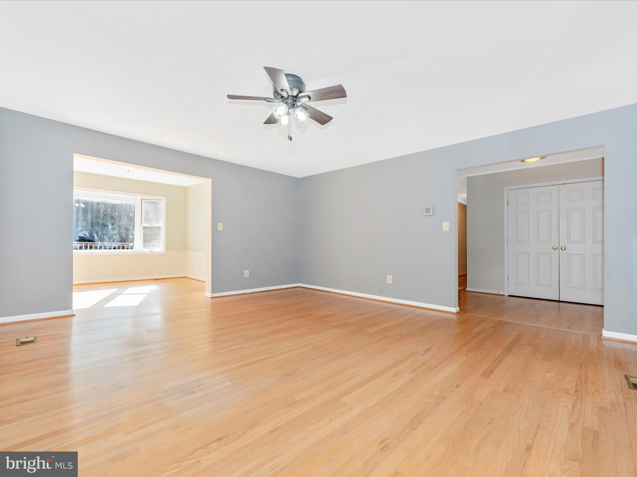 5169 Perry Road Mount Airy, MD 21771 - Photo 7 of 60 a view of an empty room with a window and wooden floor