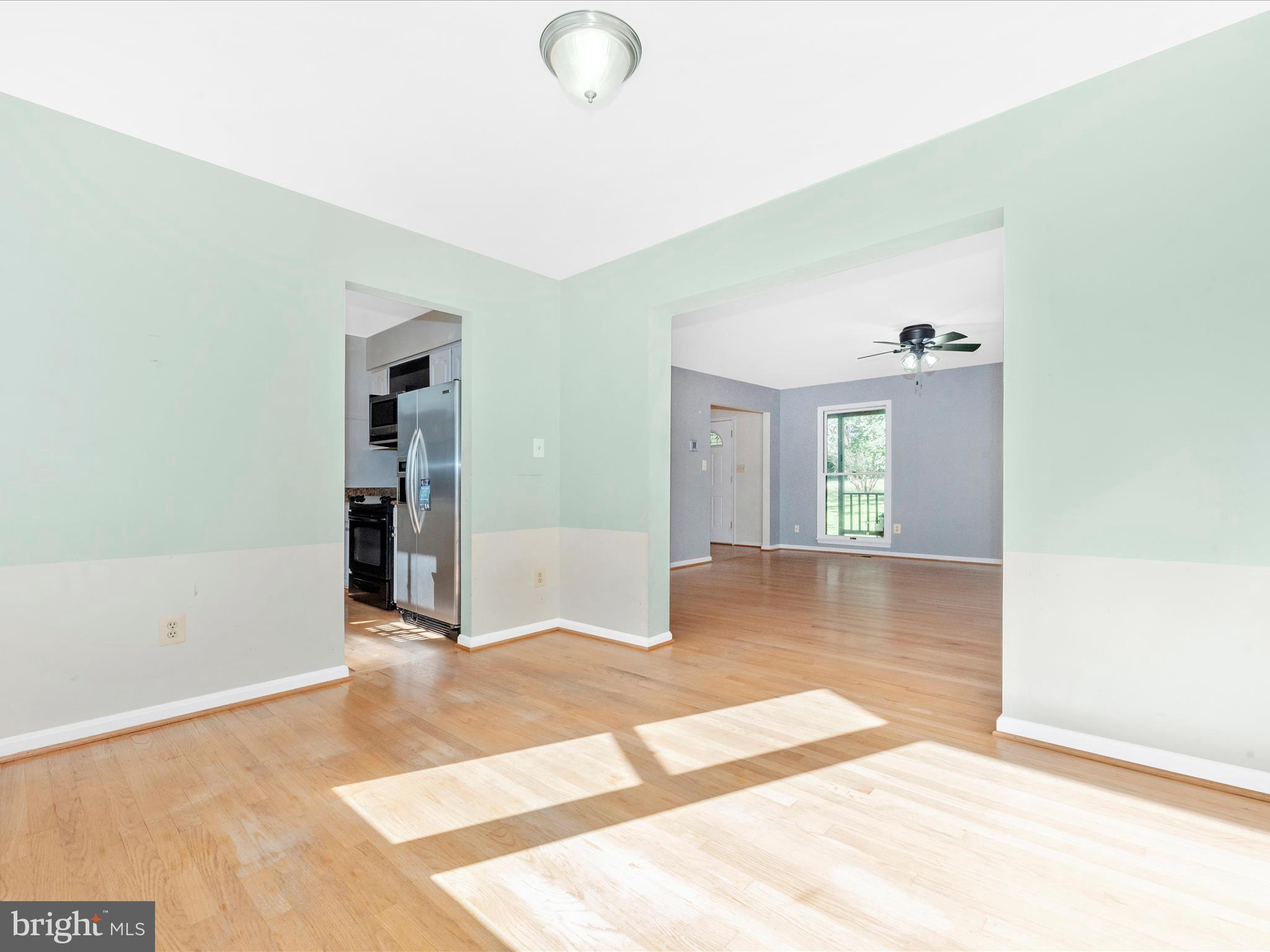 5169 Perry Road Mount Airy, MD 21771 - Photo 9 of 60 a view of an empty room with window and wooden floor
