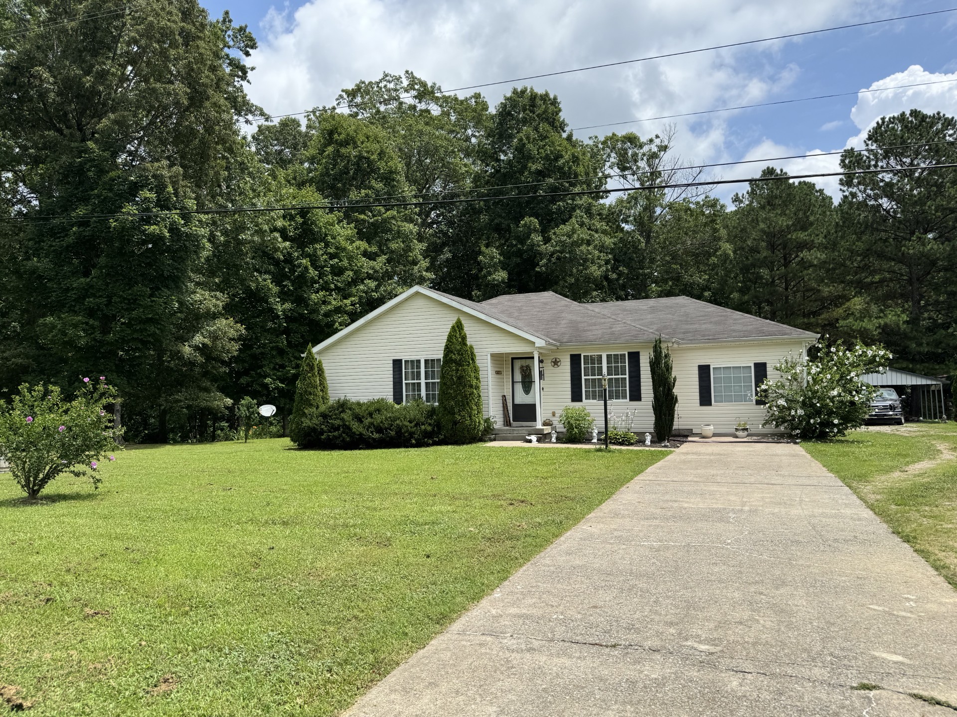 6455 Primm Springs Road Lyles, TN 37098 - Photo 1 of 30 a front view of a house with yard