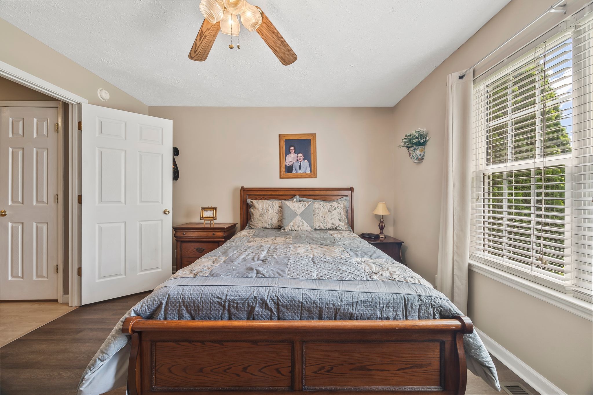 6455 Primm Springs Road Lyles, TN 37098 - Photo 16 of 30 a bedroom with a bed and wooden floor