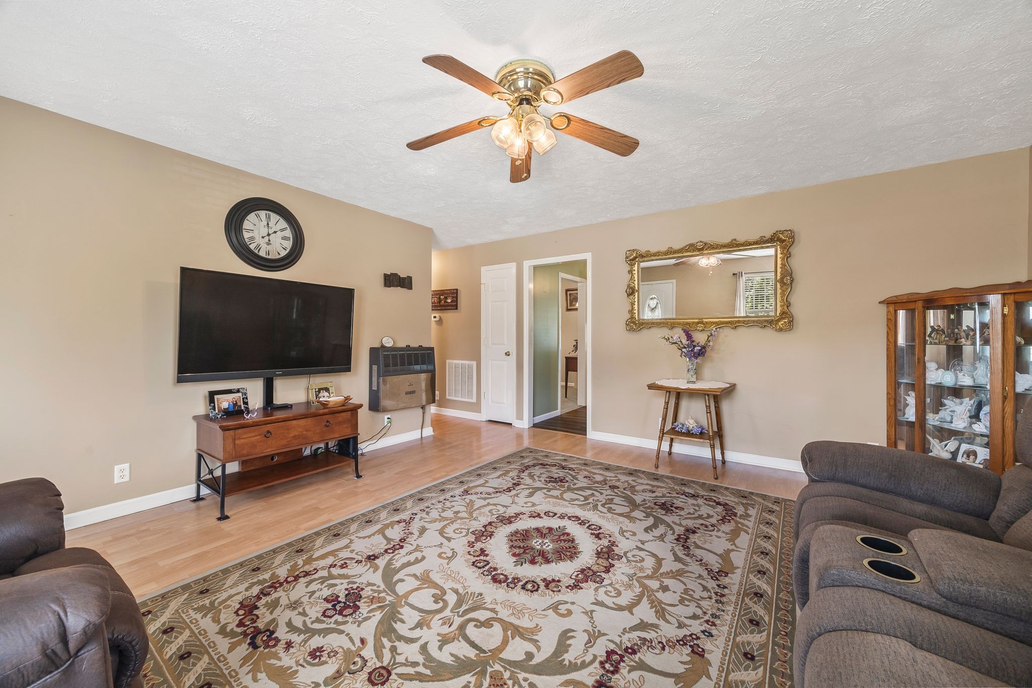 6455 Primm Springs Road Lyles, TN 37098 - Photo 9 of 30 a living room with furniture and a flat screen tv