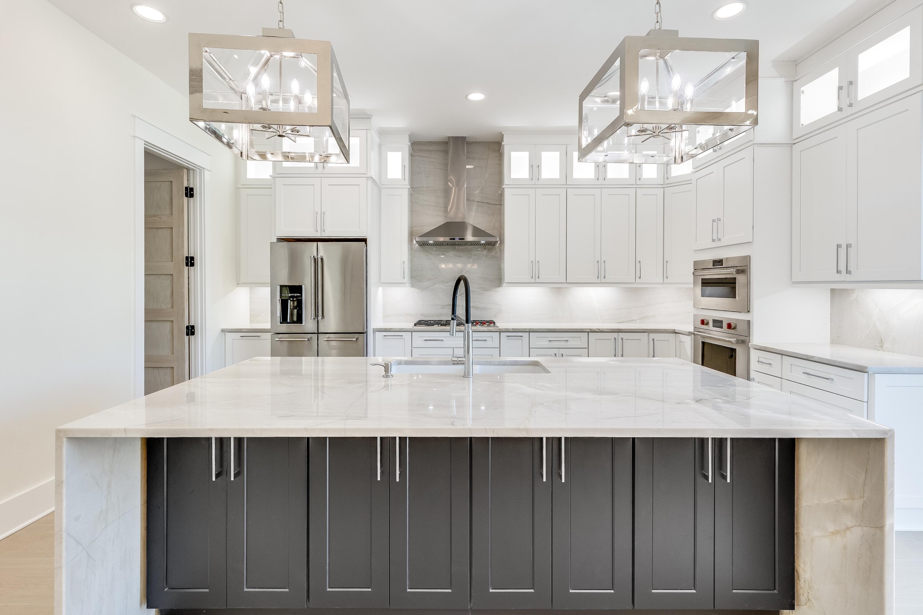 63 Maple Street Santa Rosa Beach, FL 32459 - Photo 20 of 88 a kitchen with a table and chandelier