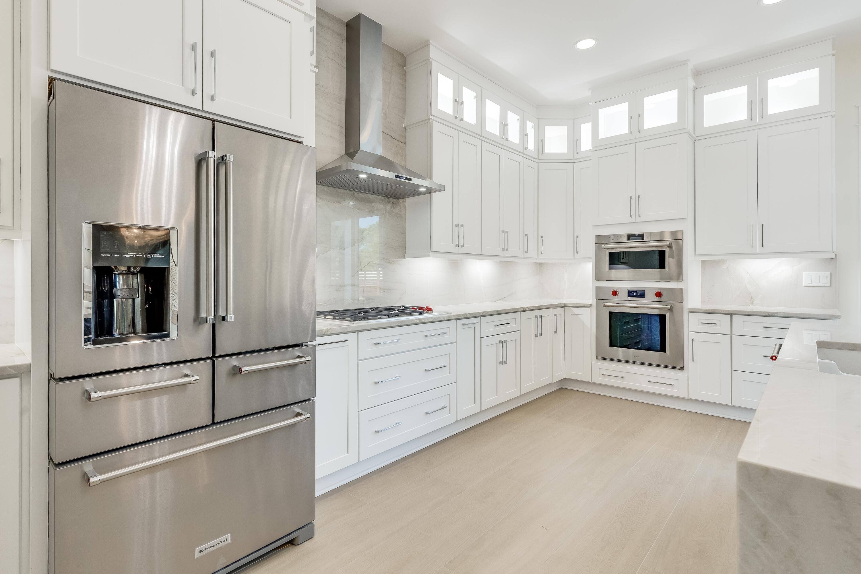 63 Maple Street Santa Rosa Beach, FL 32459 - Photo 22 of 88 a kitchen with stainless steel appliances a refrigerator sink and cabinets