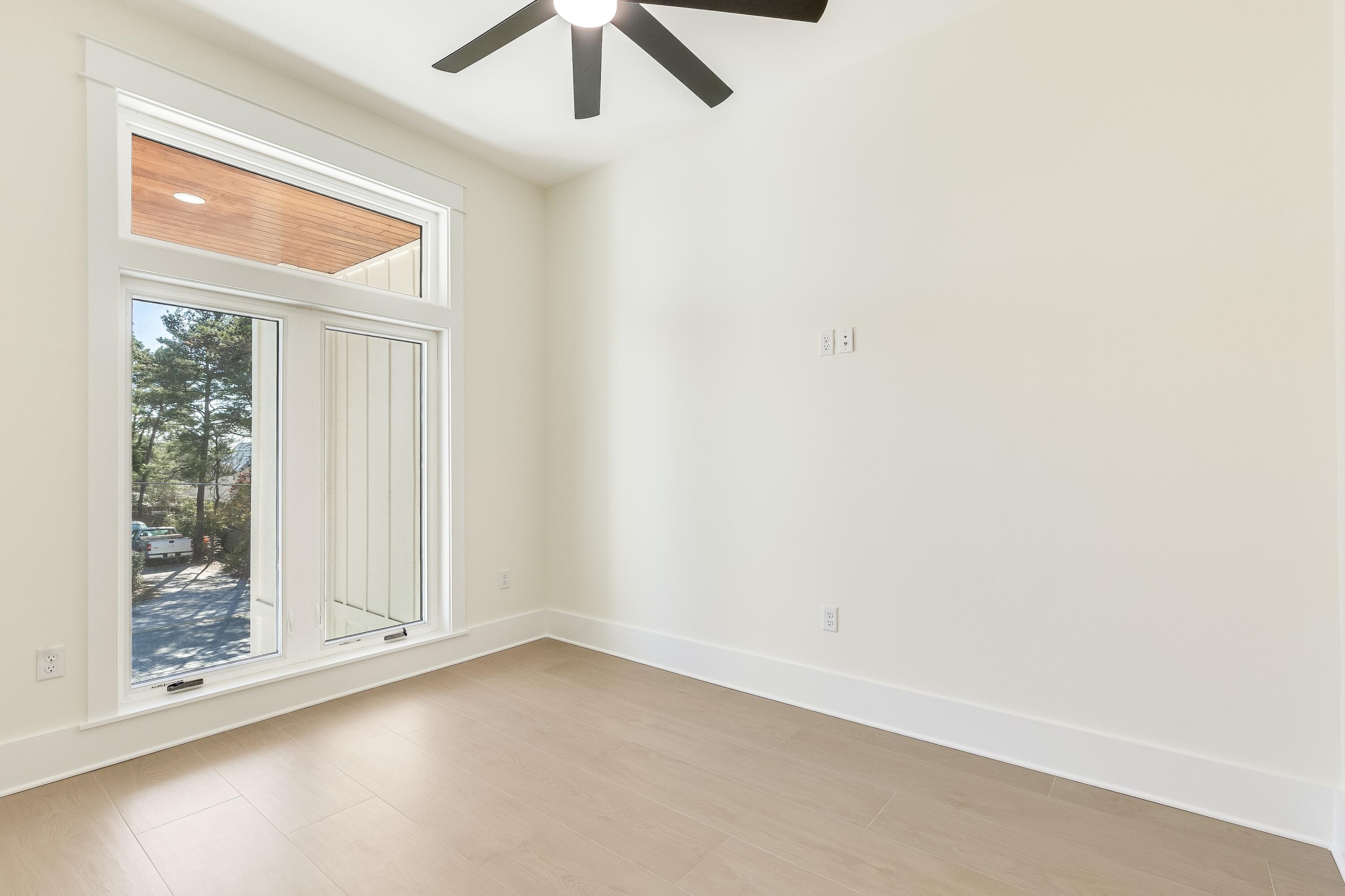 63 Maple Street Santa Rosa Beach, FL 32459 - Photo 39 of 88 an empty room with a window and a ceiling fan