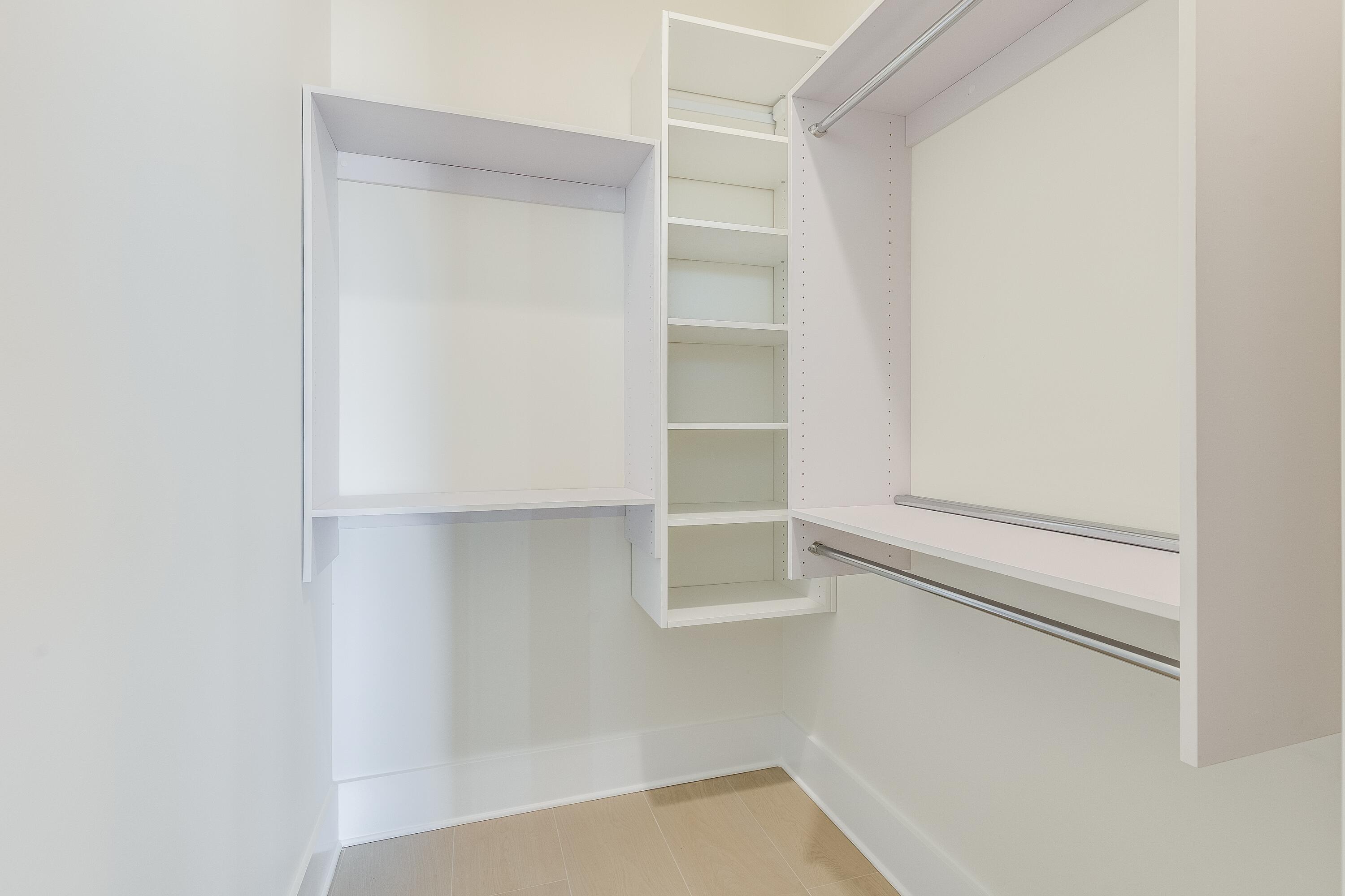 63 Maple Street Santa Rosa Beach, FL 32459 - Photo 43 of 88 a view of walk in closet with empty racks