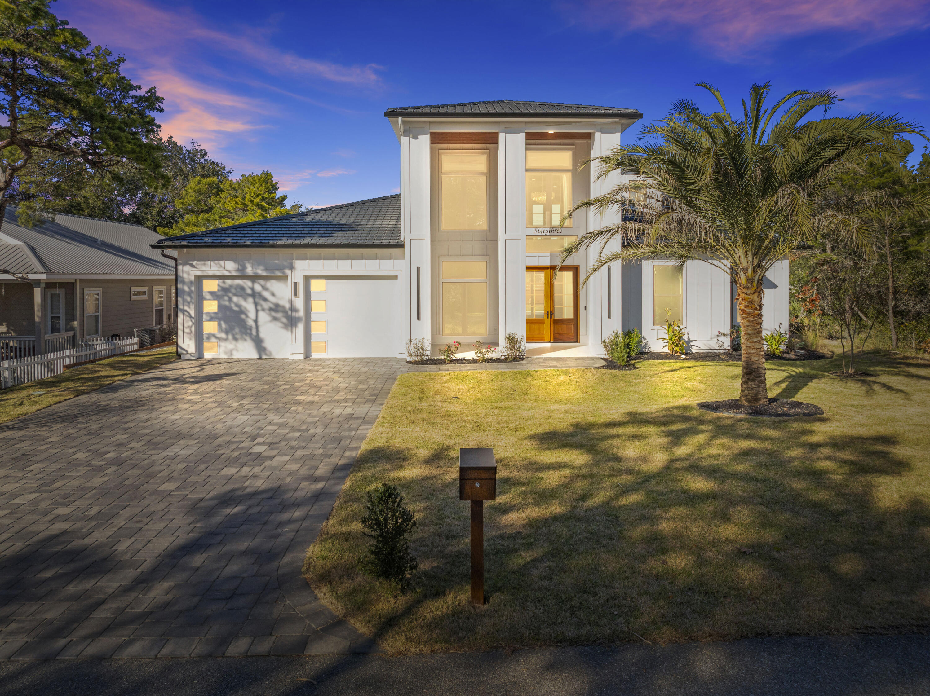 63 Maple Street Santa Rosa Beach, FL 32459 - Photo 73 of 88 a front view of a house with a yard