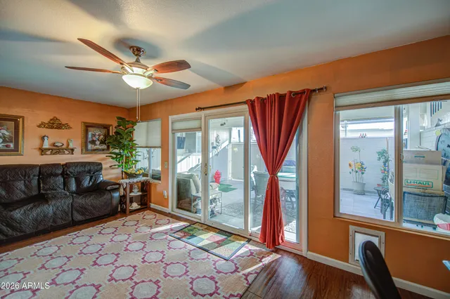 a living room with furniture and a large window