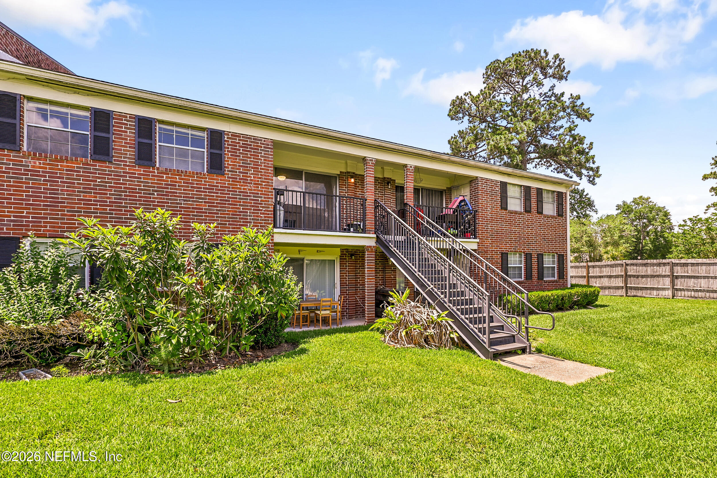 4915 Baymeadows Road, Unit 6G Jacksonville, FL 32217 - Photo 36 of 44 a view of a house with a yard