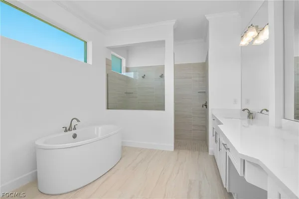 a bathroom with a bathtub and a sink