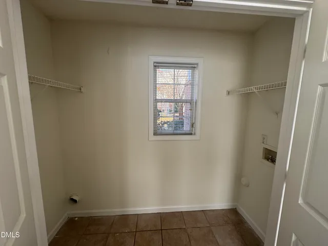 a bathroom with a toilet a sink and a mirror