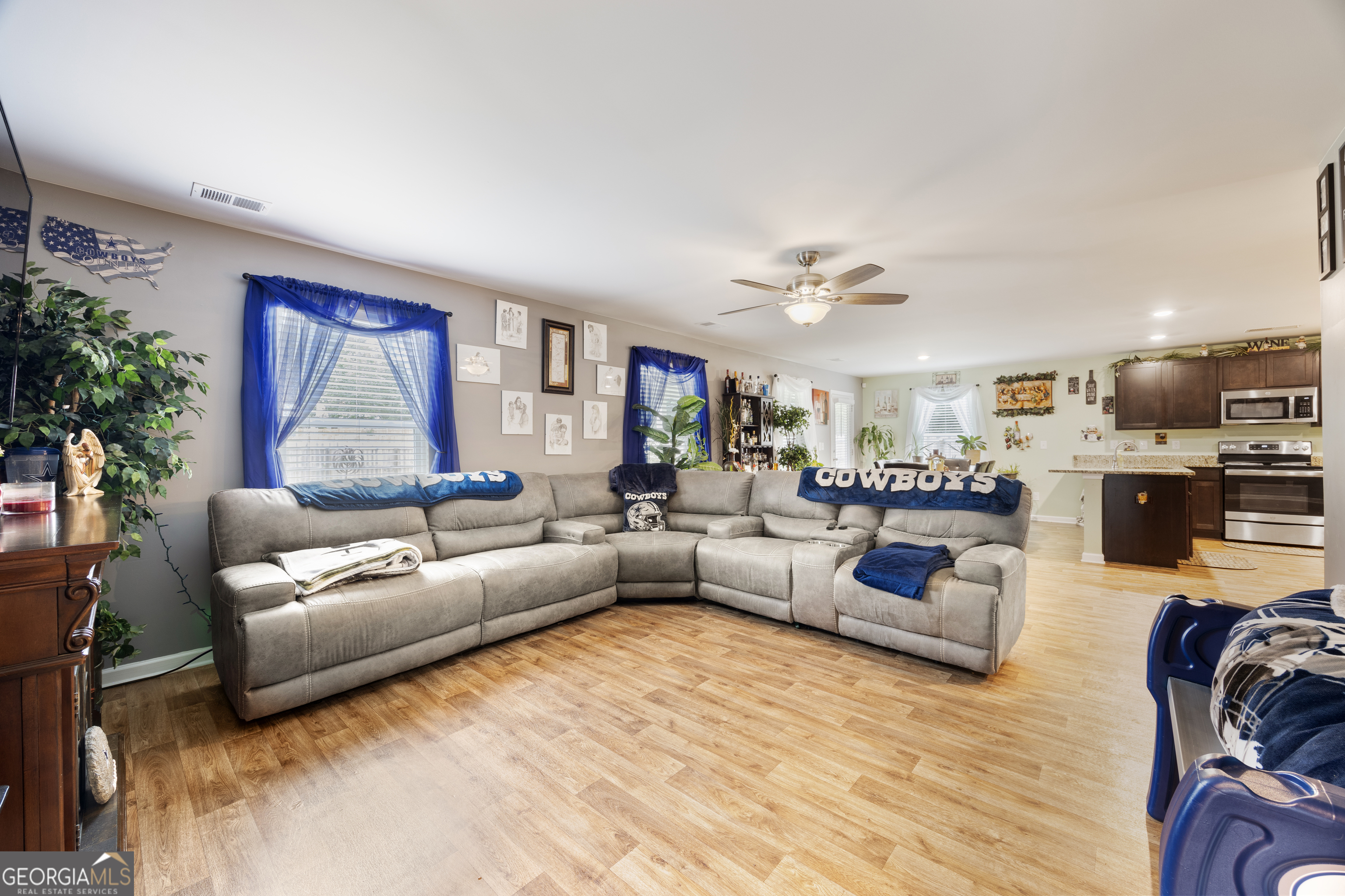 94 Galway Lane Hampton, GA 30228 - Photo 14 of 25 a living room with furniture and a large window