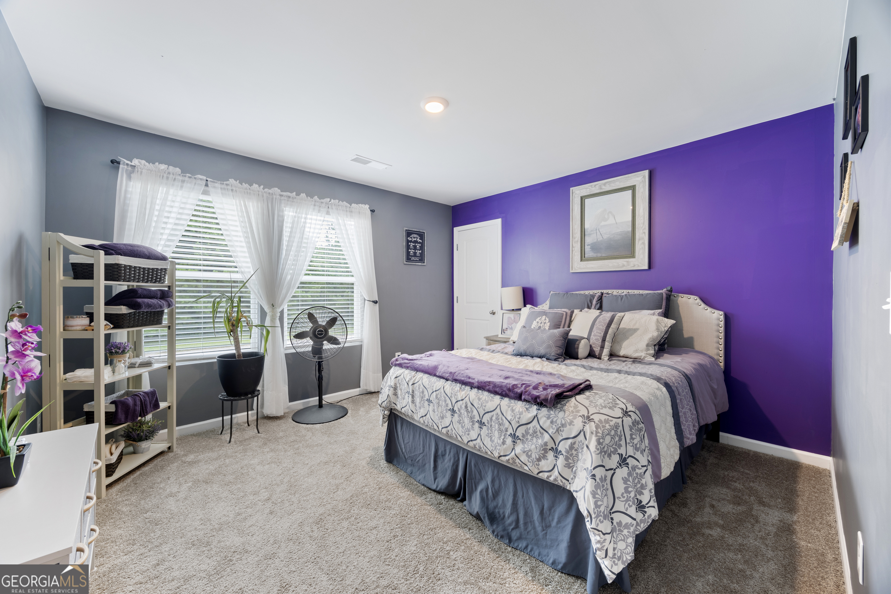 94 Galway Lane Hampton, GA 30228 - Photo 16 of 25 a bedroom with a bed and a large window